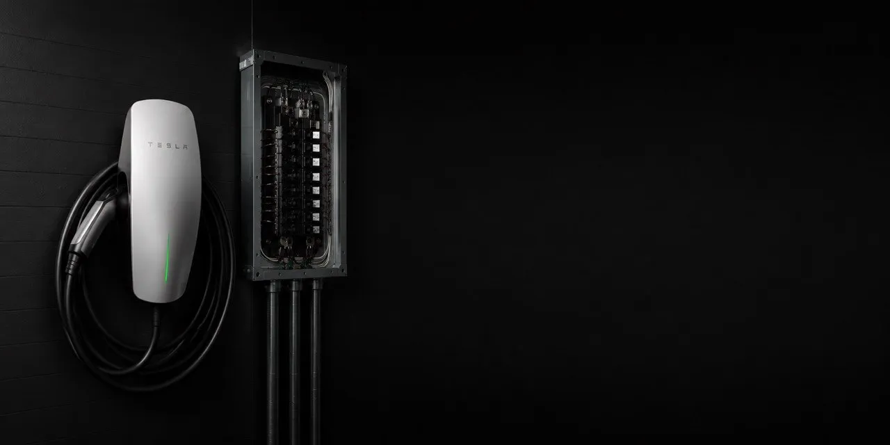 Tesla Wall Connector installed next to an electrical panel