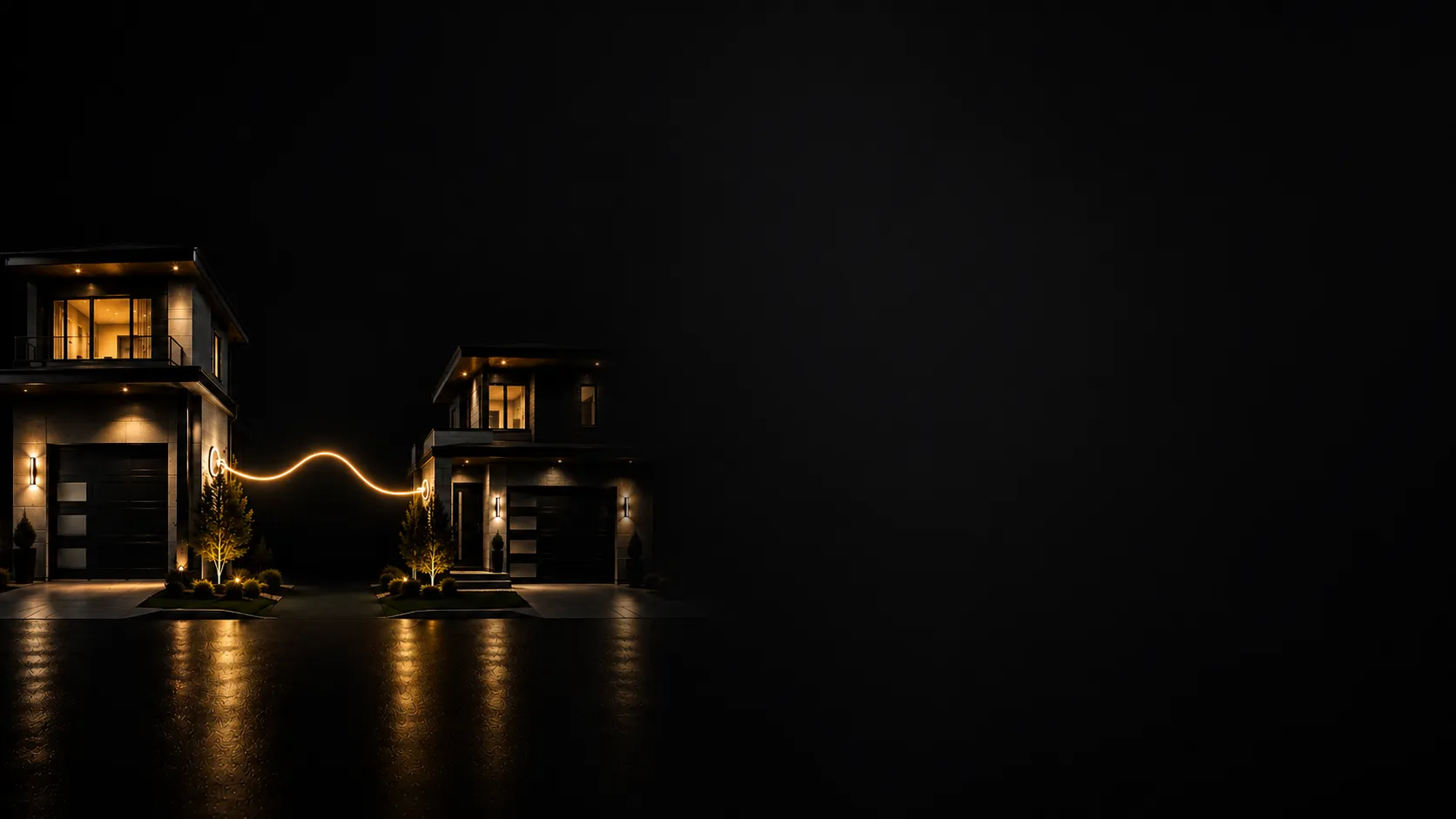 Two modern homes connected by a glowing electrical line at night