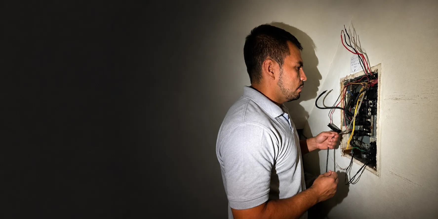 Electrician upgrading electrical panel